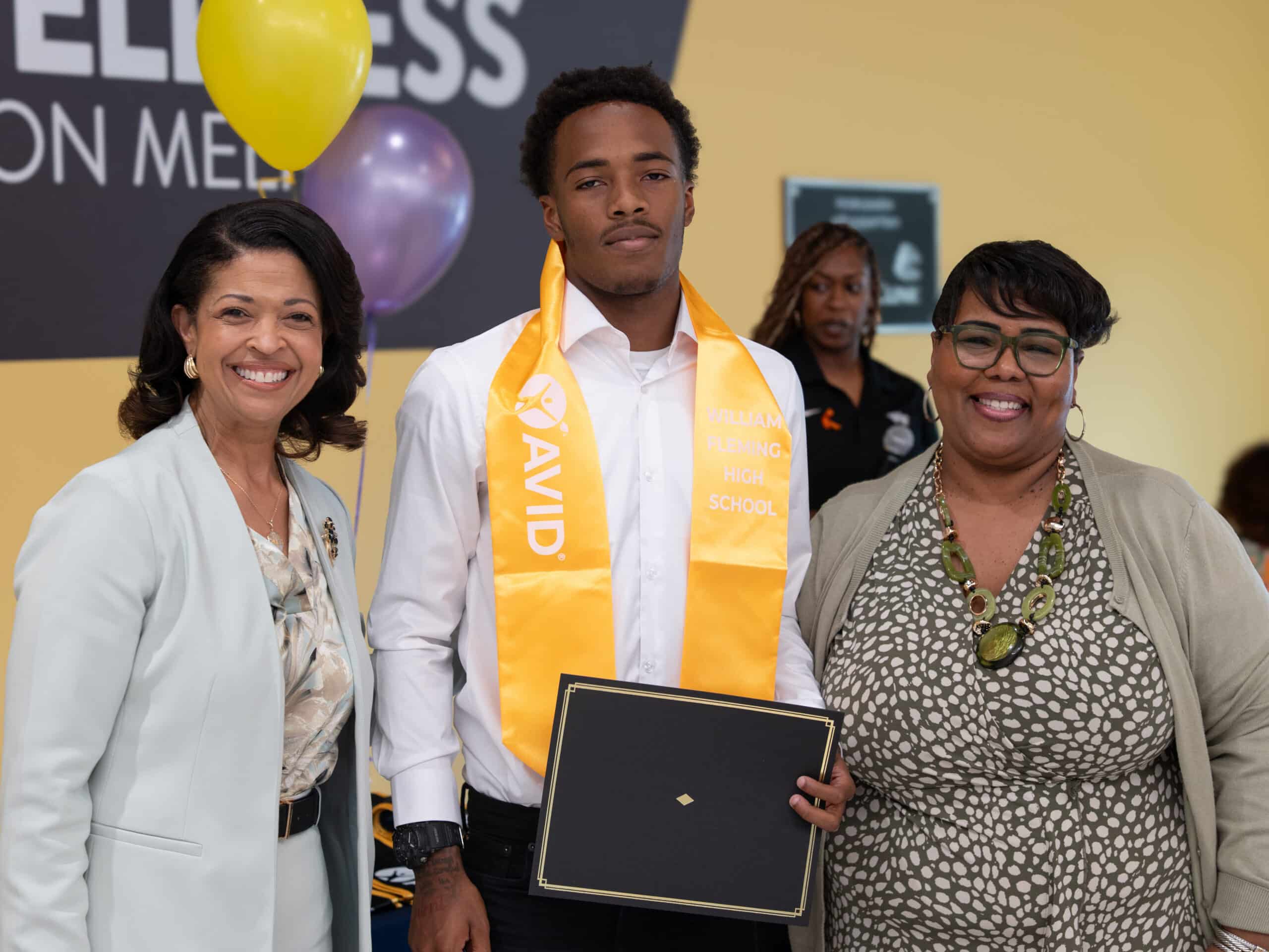 Roanoke City Schools Superintendent Dr. White smiles with graduating student